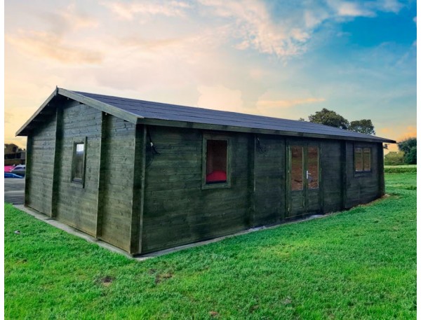Casa de madera NEREA 72m² 44mm montada en PORTUGAL con TELA ASFÁLTICA y LASUR VERDE